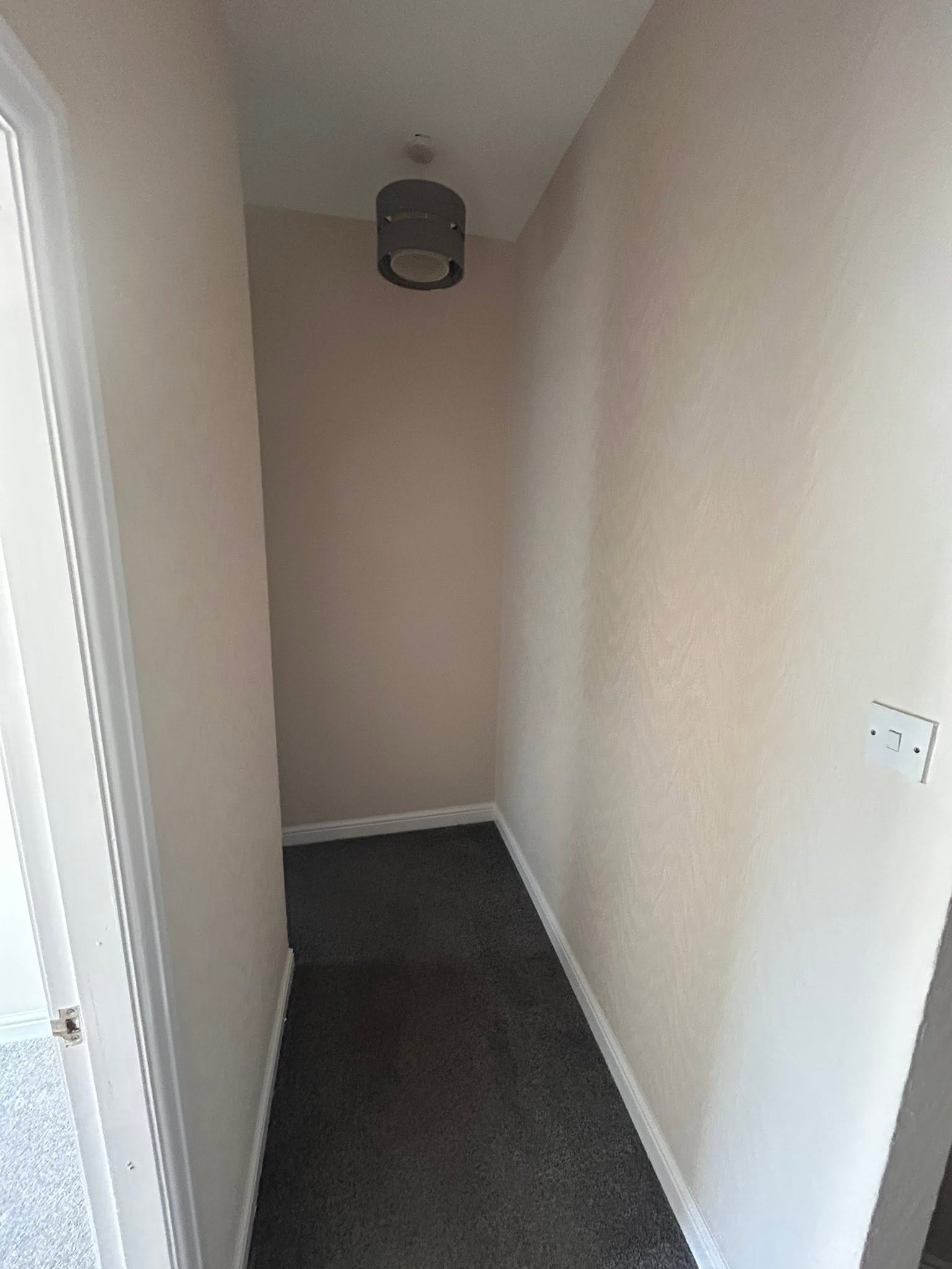 New wallpaper application on a hallway